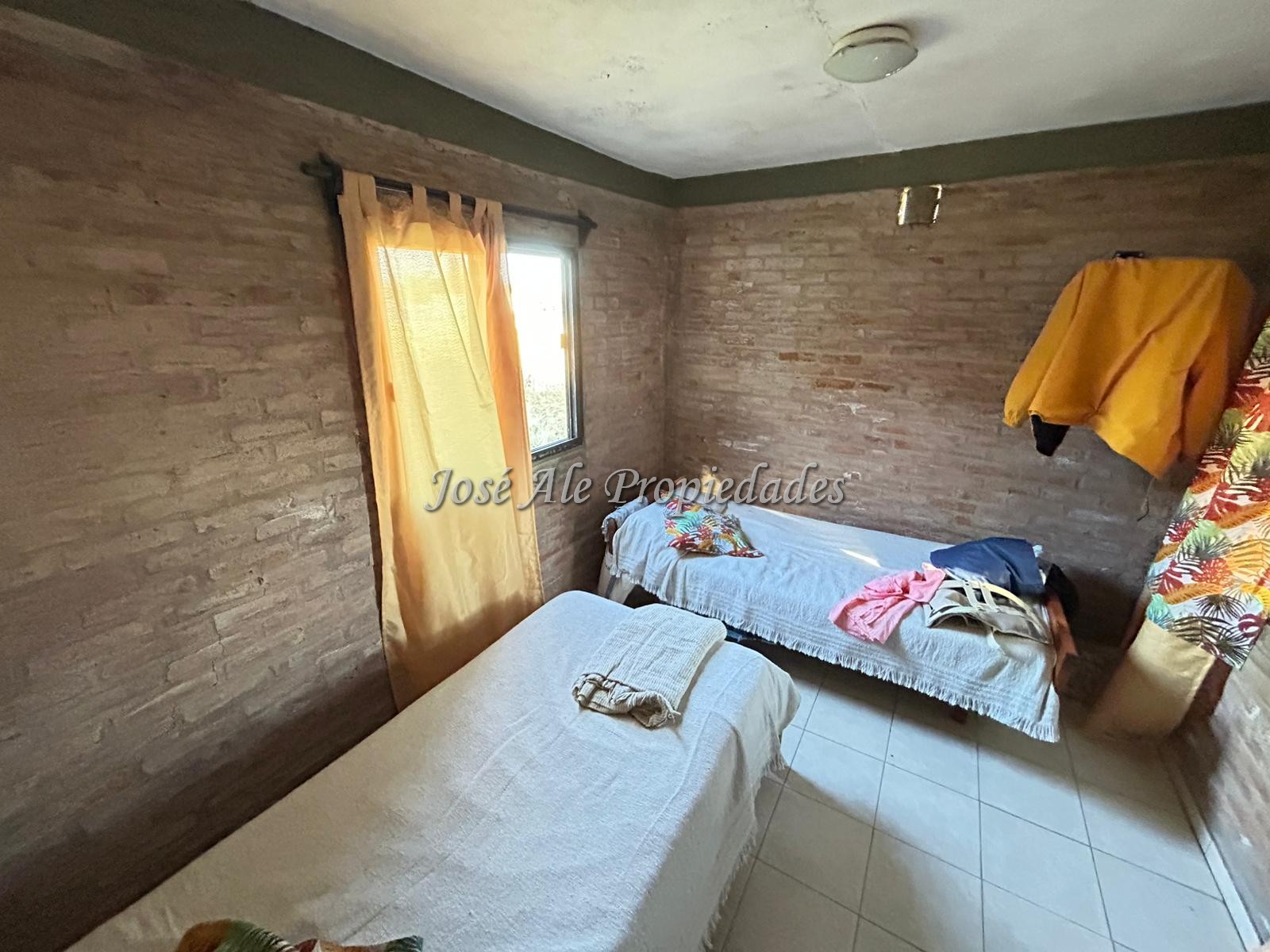 Imagen 9 de En Venta Casa con techo de quincho ubicado en espacioso terreno de 1923m2 en Altos de San Carlos, Colonia.